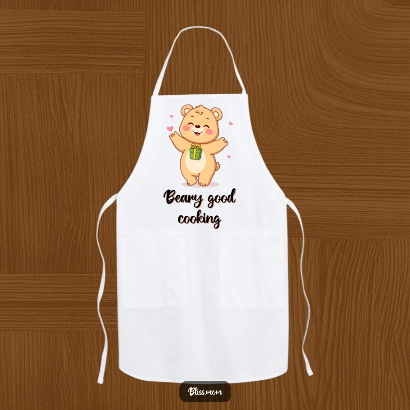 Funny apron featuring a happy bear mom playfully dancing with a small gift, ideal for kitchen fun.