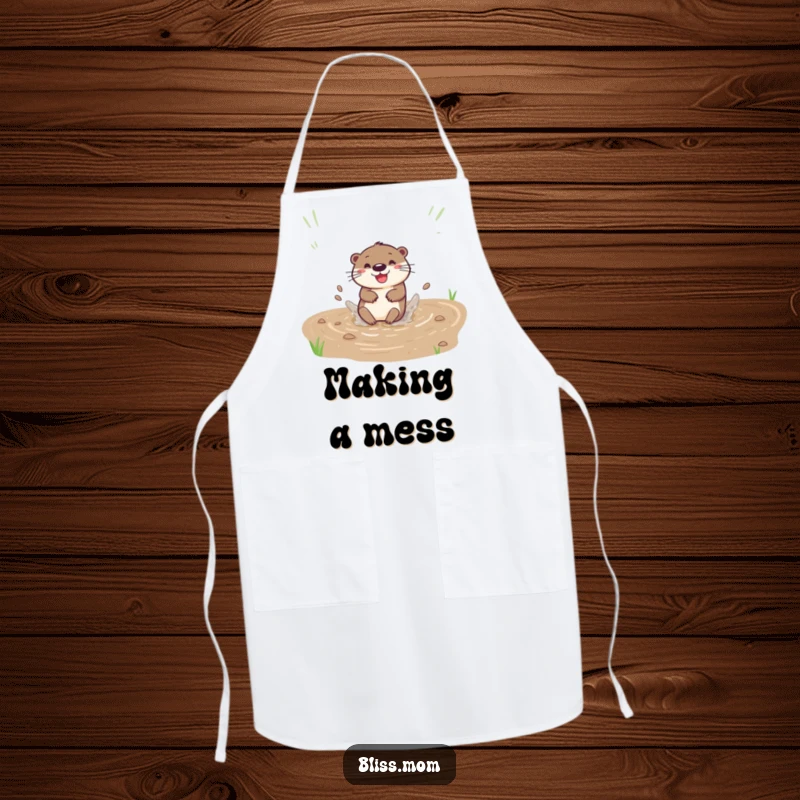 Funny apron with a happy otter sliding down a muddy bank with a splash, perfect for cheerful cooking.