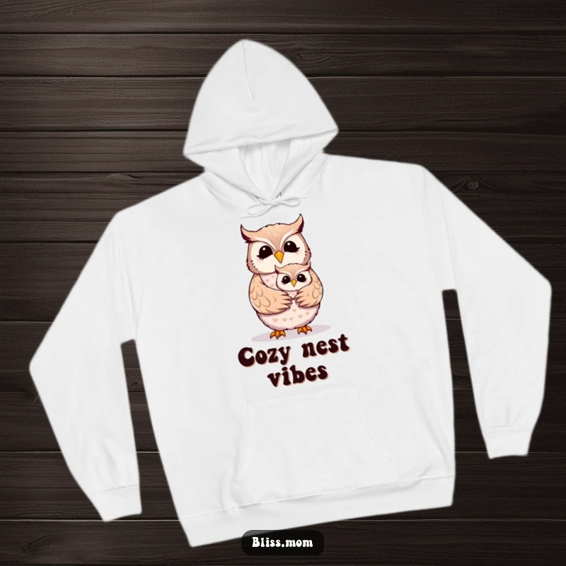Funny Mother Owl hoodie depicting a joyful mom owl receiving a loving embrace from its cute owlet.