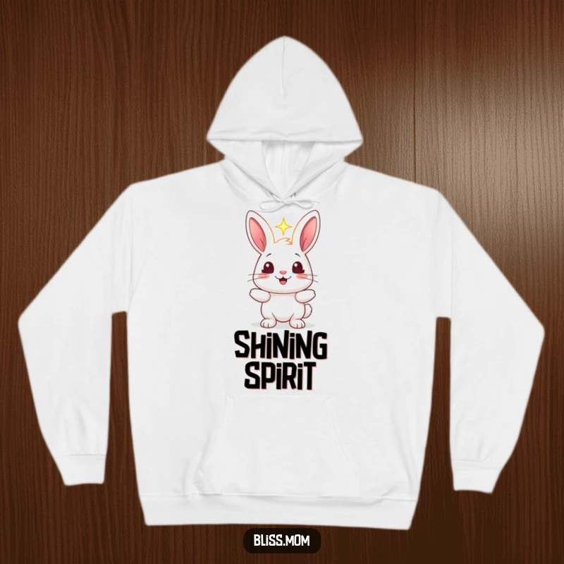 Funny rabbit hoodie featuring a cheerful bunny holding a glowing light, its eyes sparkling with joy and wonder.