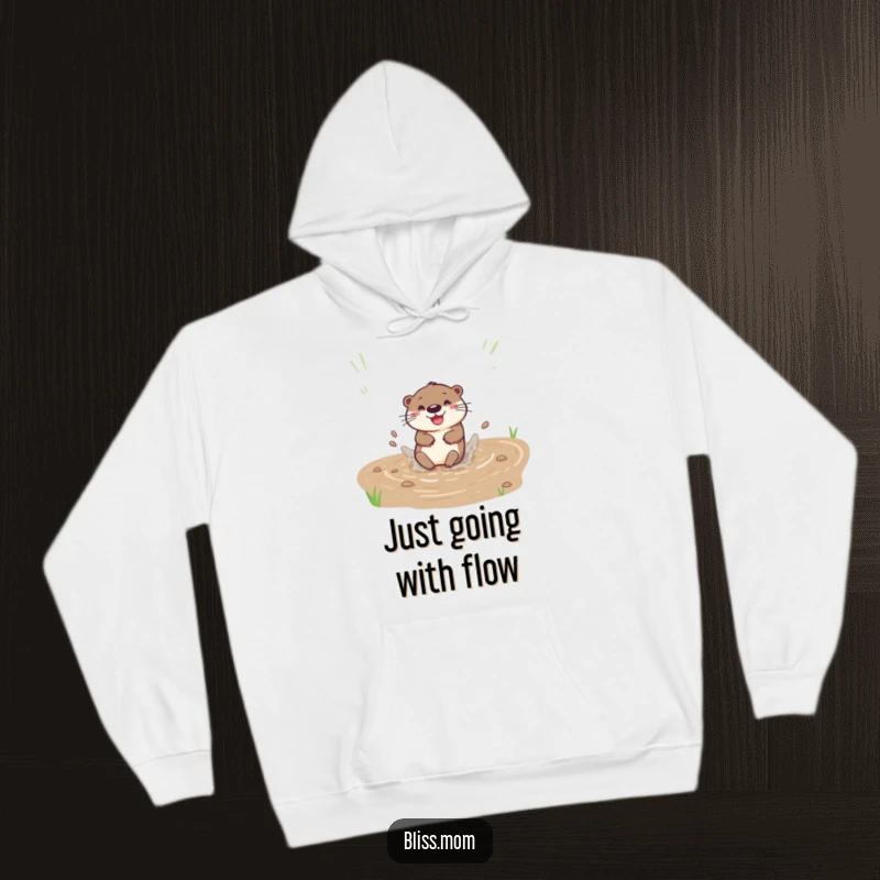 Funny hoodie with a happy otter sliding down a muddy bank with a splash, perfect for cozy water lovers.