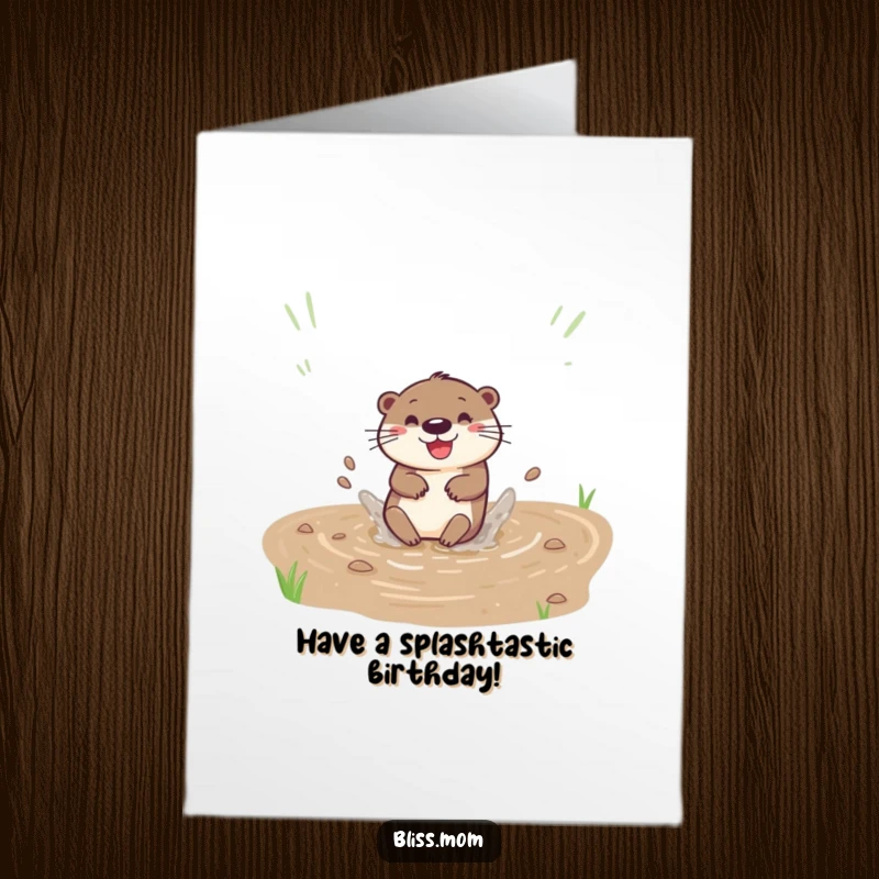 Funny Free Printable Birthday Card: A happy otter gleefully slides down a muddy bank, creating a big, joyful splash.