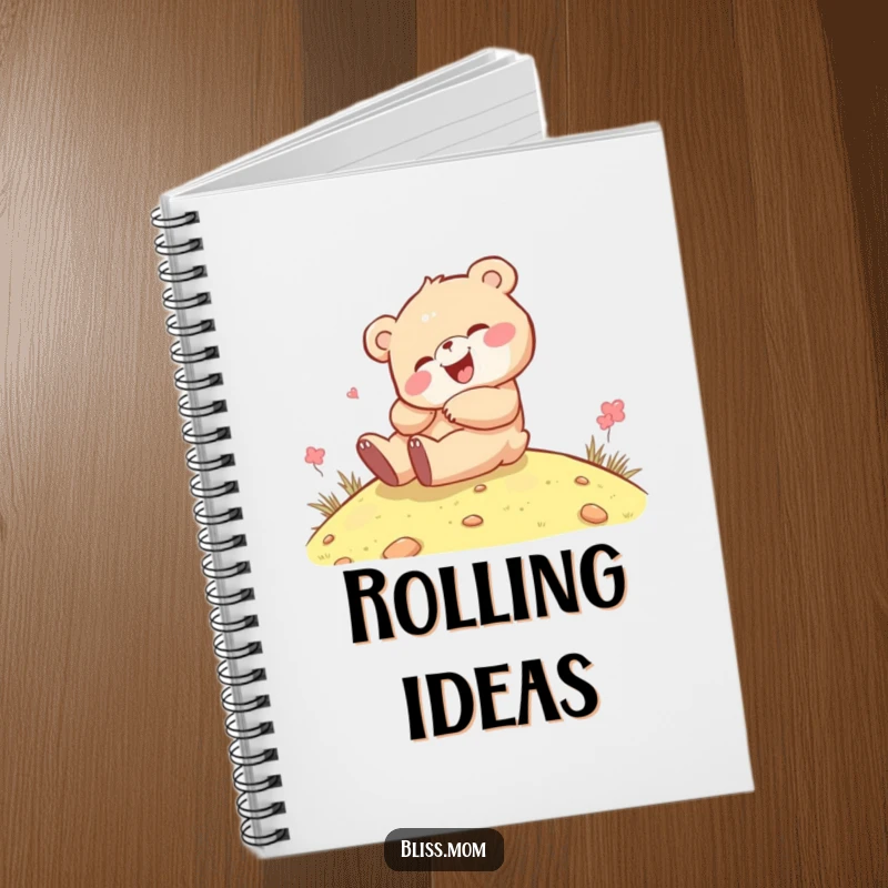 Funny kawaii bear cub giggling while rolling down a hill, on a notebook cover, inspiring playful thoughts and happy notes.