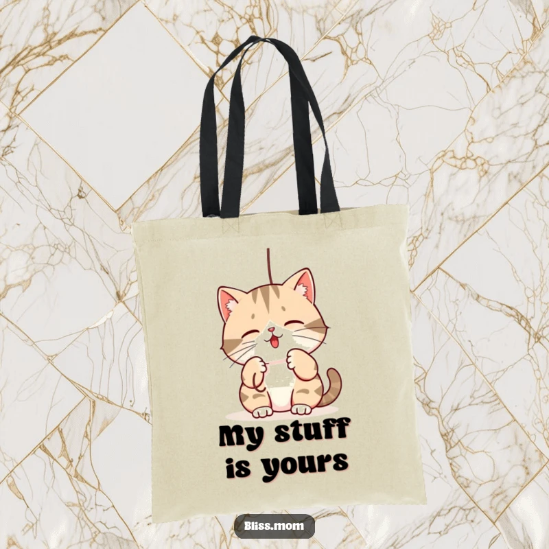 Funny tote bag: a kawaii mama cat playfully batting at a dangling string, ideal for carrying essentials with feline flair.