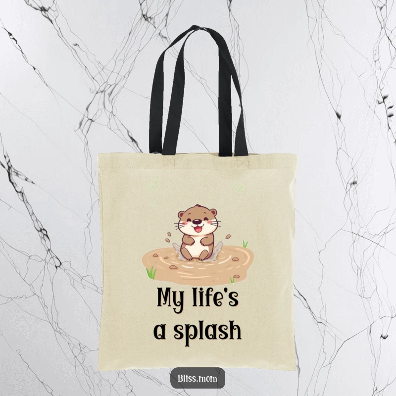 Funny tote bag featuring a happy otter sliding down a muddy bank with a splash, perfect for carrying essentials.